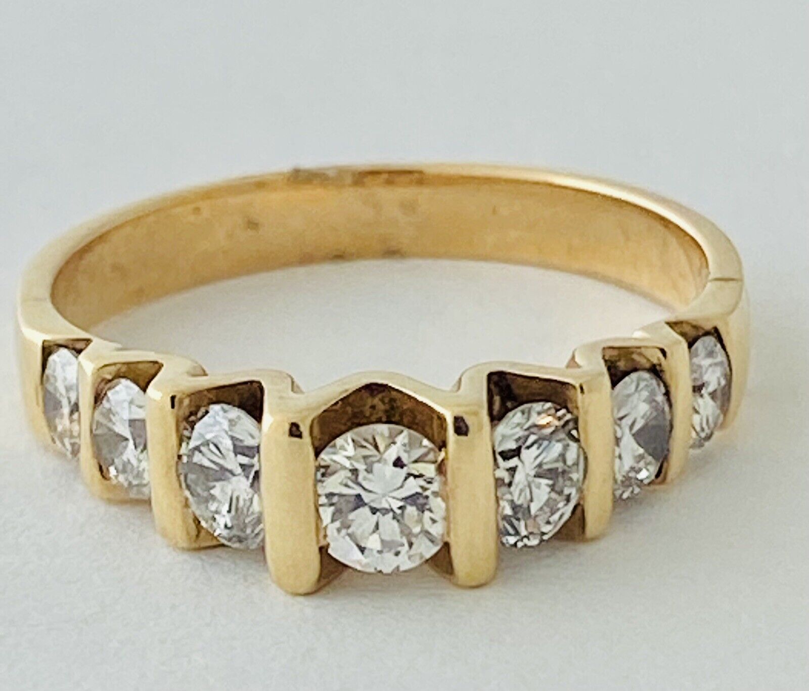 14kt Yellow Gold Seven Diamonds Cannel Set Ring
