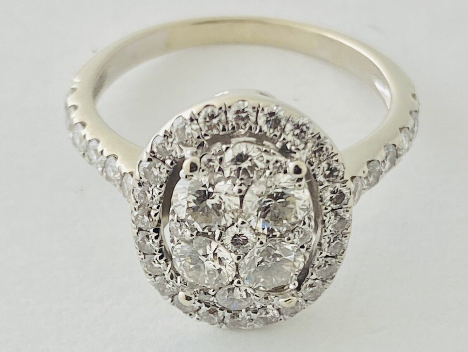 14kt White Gold , Round Diamonds Forming An Oval Shape With Pave Halo