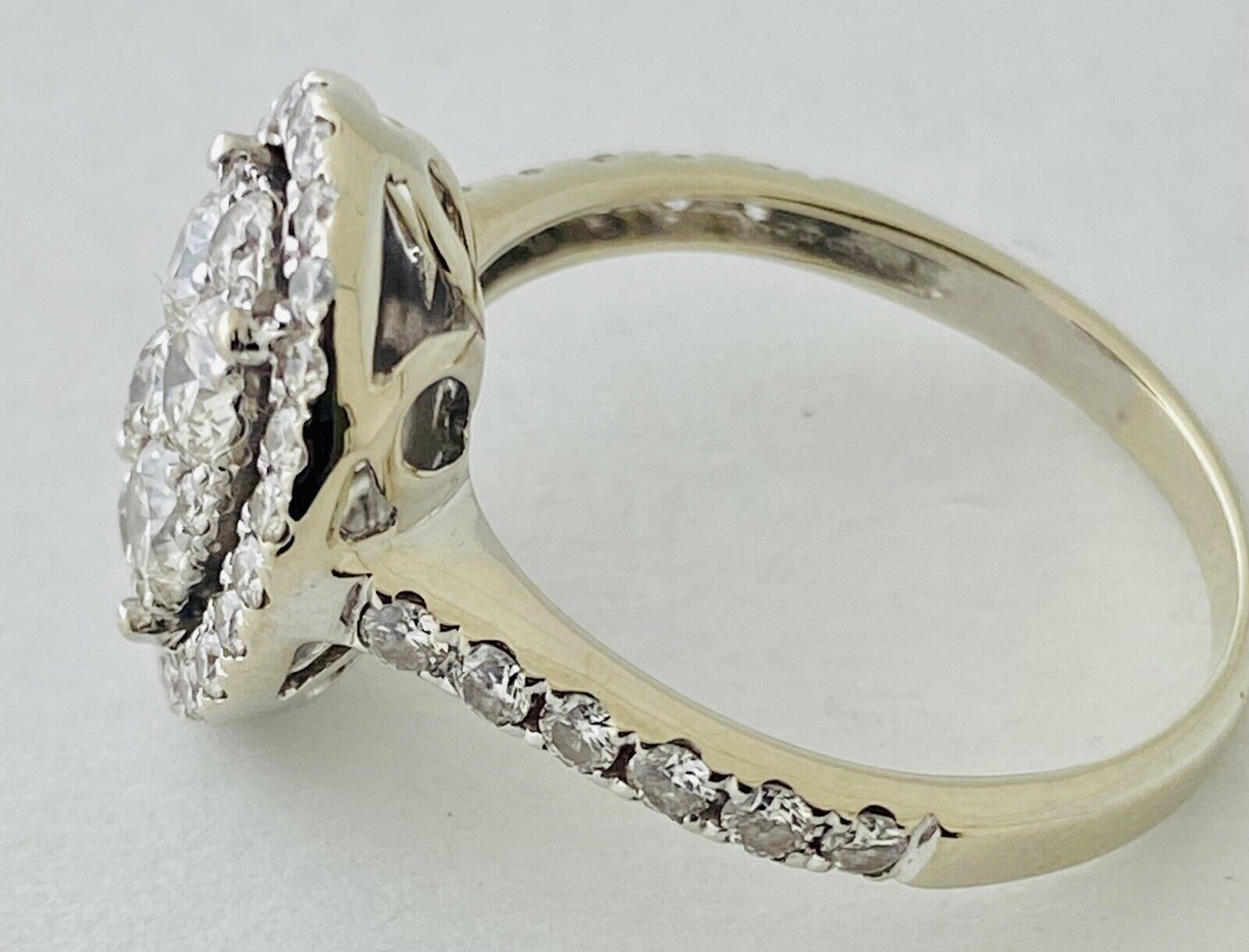 14kt White Gold , Round Diamonds Forming An Oval Shape With Pave Halo