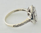 14kt White Gold , Round Diamonds Forming An Oval Shape With Pave Halo