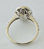 14kt White Gold , Round Diamonds Forming An Oval Shape With Pave Halo