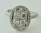 14kt White Gold , Round Diamonds Forming An Oval Shape With Pave Halo