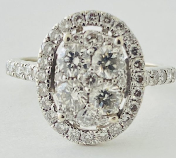 14kt White Gold , Round Diamonds Forming An Oval Shape With Pave Halo